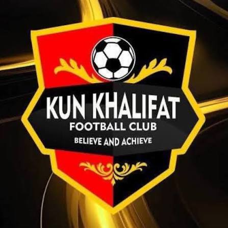 Logo for Kun Khalifat Football Club a shield with red and black halves a soccer ball at the top gold accents and the motto Believe and Achieve  trybalnews