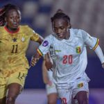 Female soccer players sprint for the ball in a match white jersey with number 20 leads a chase against a yellow jersey opponent no 11  trybalnews