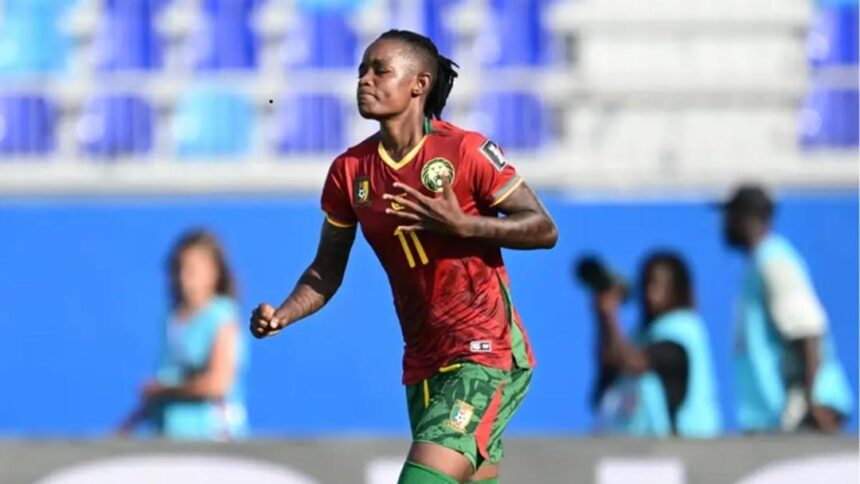Soccer player in red jersey with number 11 running on a blue stadium field during a match  trybalnews