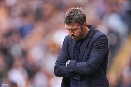 Manchester United head coach Michael Carrick stands on the touchline with arms crossed during the Premier League 2026/27 match between Hull City and Manchester United at MKM Stadium on August 22, 2026 in Hull, United Kingdom