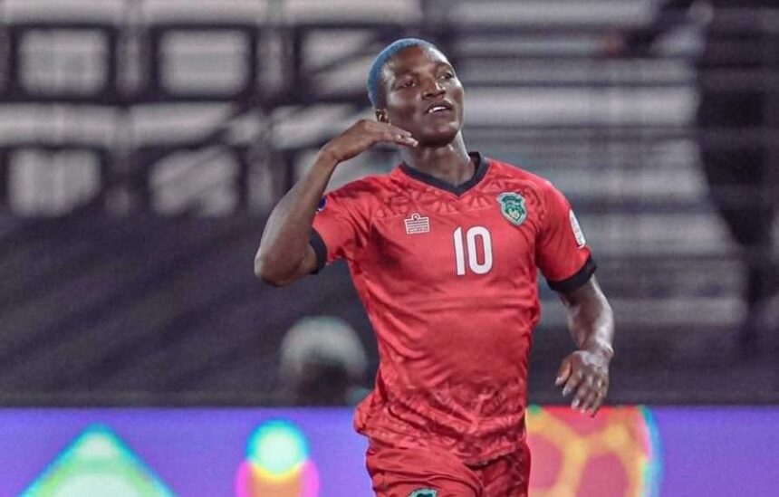 Soccer player in a red jersey with the number 10 celebrating a goal on the pitch  trybalnews