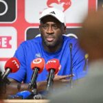 Yaya Toure head coach of Slovan Bratislava wearing a blue shirt and white Adidas cap speaks at a press conference with microphones in front of him The press conference followed the UEFA Champions League 202627 second qualifying round first leg match between Iberia Tbilisi and Slovan Bratislava at Mikheil Meskhi Stadium on July 21 2026 in Tbilisi Georgia  trybalnews