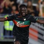 Akor Adams of Venezia FC in a black green and orange jersey with number 4 celebrates with arms outstretched after scoring the opening goal during the Serie A match between Venezia and ACF Fiorentina at Stadio Pier Luigi Penzo on September 11 2026 in Venice Italy  trybalnews