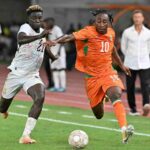 Ivory Coast forward Yan Diomande wearing number 10 battles Ghana defender Kojo Peprah Oppong for the ball during the 2027 Africa Cup of Nations qualifier between Ivory Coast and Ghana at Stade de Bouake  trybalnews