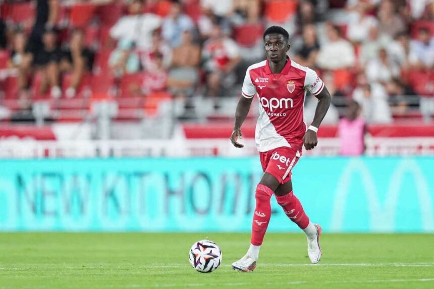 Lamine Camara of AS Monaco wearing a red and white home kit dribbles a football during the Ligue 1 McDonalds match between Monaco and Marseille at Louis II Stadium on August 30 2026 in Monaco Fans in red seats are blurred in the background  trybalnews