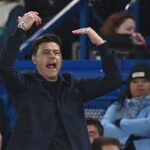 Mauricio Pochettino in a dark coat and black shirt gestures with both hands raised on the touchline during the English Premier League match between Chelsea and Tottenham Hotspur at Stamford Bridge in London on May 2 2024  trybalnews