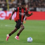Nigeria winger Samuel Chukwueze wearing AC Milans red and black striped home kit dribbling the ball during the Serie A match between Juventus and AC Milan at the stadium in Turin Italy on September 6 2026  trybalnews
