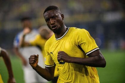 Serhou Guirassy of Borussia Dortmund celebrates with clenched fists wearing a yellow home jersey during the UEFA Champions League 2026/27 League Phase match between Borussia Dortmund and Villarreal CF at BVB Stadion Dortmund in Dortmund, Germany on September 8, 2026.