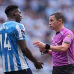 Referee Tony Harrington speaking with Coventry City forward Taiwo Awoniyi wearing number 14 during the Premier League match between Coventry City and Brighton  Hove Albion at The Coventry Building Society Arena on September 13 2026  trybalnews