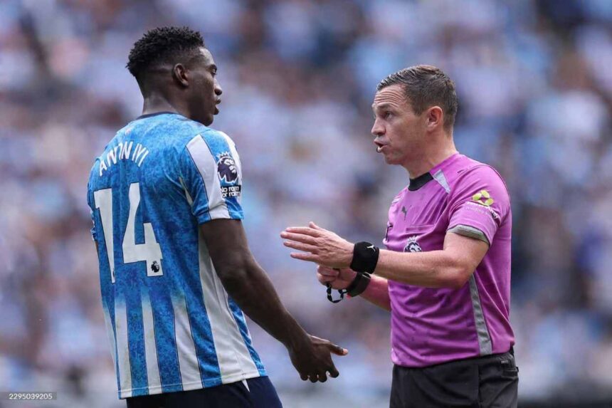 Referee Tony Harrington speaking with Coventry City forward Taiwo Awoniyi wearing number 14 during the Premier League match between Coventry City and Brighton  Hove Albion at The Coventry Building Society Arena on September 13 2026  trybalnews