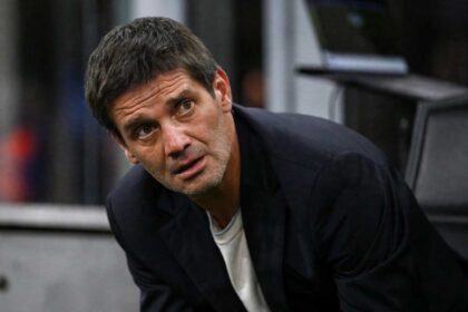 Inter Milan head coach Cristian Chivu leaning forward on the touchline and looking intently during the UEFA Champions League 2026/27 League Phase MD2 match between FC Internazionale Milano and Club Brugge KV at Stadio San Siro on October 13, 2026, in Milan, Italy.