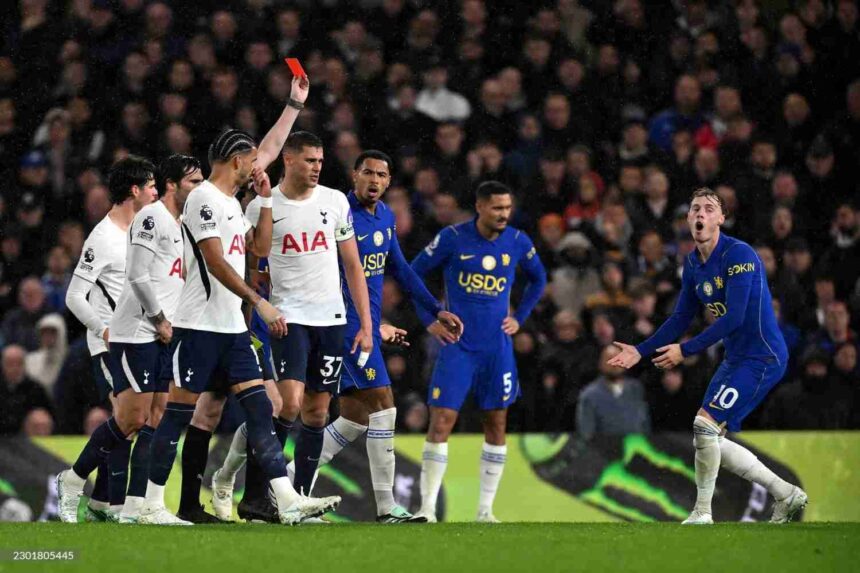 Chelseas Cole Palmer with arms outstretched in disbelief as referee shows red card during Premier League match against Tottenham Hotspur at Stamford Bridge teammates and opponents watching  trybalnews