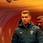 Cristiano Ronaldo of Portugal walks through the tunnel in a dark green Portugal puffer jacket ahead of the UEFA Nations League match against Norway at Ullevaal Stadion in Oslo Norway  trybalnews