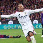 Real Madrid forward Kylian Mbappe in white kit with arms outstretched celebrating goal against Barcelona in El Clasico at Camp Nou  trybalnews