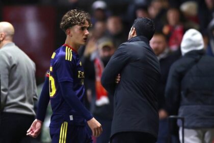 Arsenal manager Mikel Arteta speaks to Max Dowman as the young forward walks off after being sent off during Fleetwood Town vs Arsenal Carabao Cup match at Highbury Stadium
