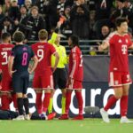 Michael Olise of FC Bayern Munich wearing the red Bayern kit with dreadlocks receives a red card from the referee during the UEFA Champions League 202627 League Phase MD2 match between Viking FK and FC Bayern Munich at Viking Stadion on October 13 2026 in Stavanger Norway Teammates including Harry Kane number 9 look on as a Viking FK player lies injured on the pitch  trybalnews