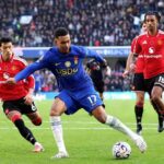 Chelseas Morgan Rogers wearing the blue No 17 kit runs with the ball past Manchester United defenders in red during the Premier League match at Stamford Bridge  trybalnews