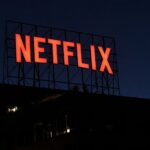 The illuminated Netflix logo in bright red letters on a large rooftop sign structure at night on top of an office building in Los Angeles California on May 29 2026  trybalnews