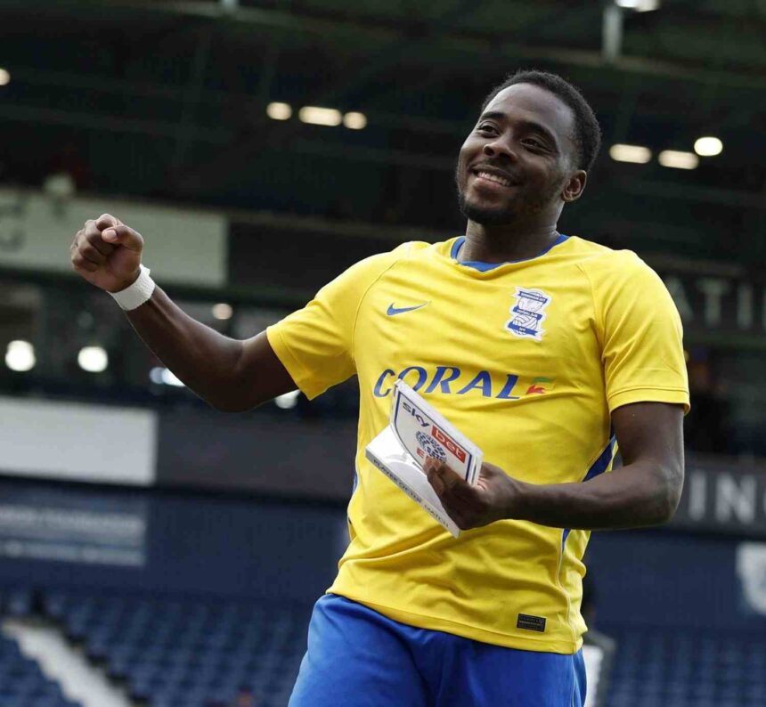 Birmingham City player Bright Osayi Samuel smiles and raises a fist while holding a Sky Bet Player of the Match trophy He is wearing Birminghams yellow away shirt at The Hawthorns stadium  trybalnews