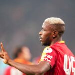Victor Osimhen gestures with his finger raised while wearing a Galatasaray red and yellow jersey during a Turkish Super Lig match  trybalnews