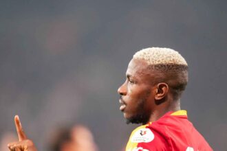 Victor Osimhen gestures with his finger raised while wearing a Galatasaray red and yellow jersey during a Turkish Super Lig match  trybalnews