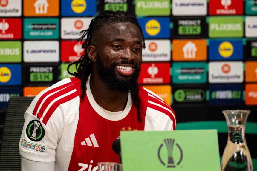 Ajax striker Tolu Arokodare smiling in Ajax home jersey during post match press conference at Johan Cruijff Arena after Conference League victory over Atalanta  trybalnews