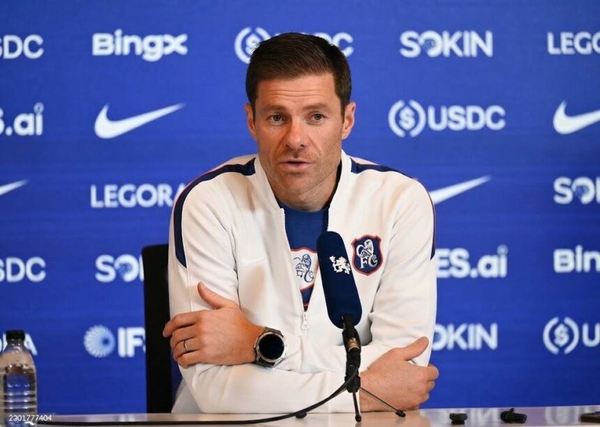 Chelsea manager Xabi Alonso sitting at a table answering questions during a press conference at Chelsea Training Ground in Cobham  trybalnews